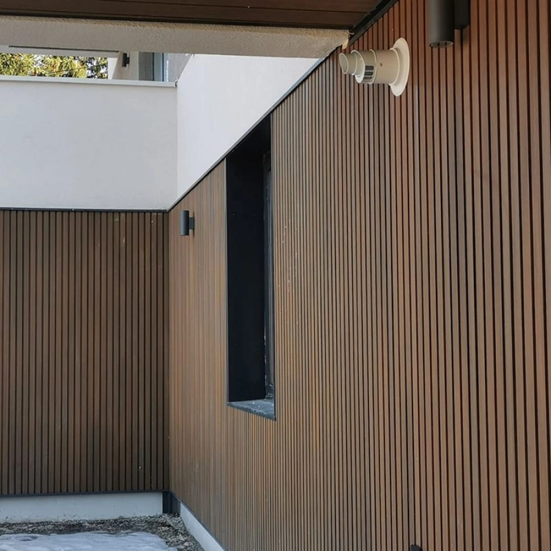 Dark wood fluted panels on a modern exterior wall