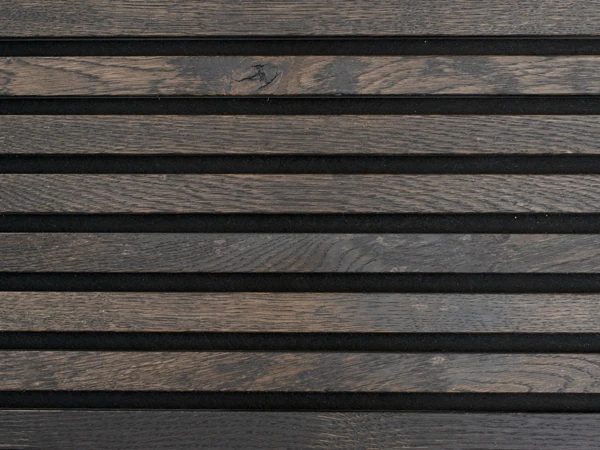 Black Forest dark espresso-stained wood slat wall paneling with deep grain patterns and black felt backing